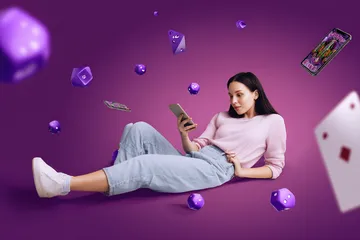 A woman smiling by bright slot machines showing lucky symbols, showcasing the exciting slot offerings at VK8.